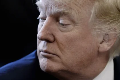 President Donald Trump looks on during a National Economic Council meeting in the Oval Office at the White House March 24, 2017 in Washington, DC.